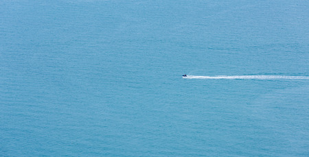 Speed Boat surf long foam aerial in blue seaの写真素材