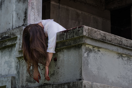 Murder Asian girl in deserted building hang headの写真素材