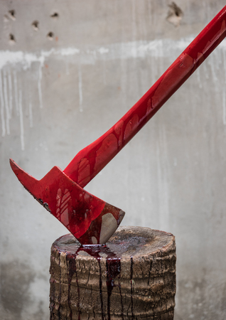 assassin instrument crime axe in puddle blood on Timberの写真素材