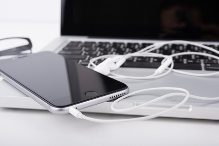 laptop,notebook and mobile phone, smartphone on office desk table.の写真素材