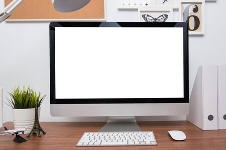Monitor computer PC workspace in home or studio on wooden deskの写真素材
