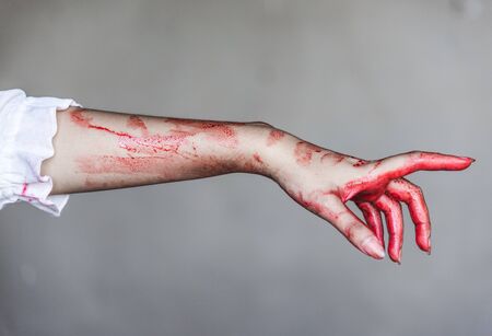 Ghost woman or Zombie stretching bloody hands, halloween conceptの写真素材