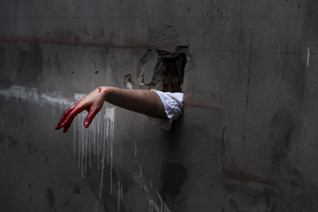 Hand of Ghost woman or Zombie Penetrate wall ,halloween conceptの写真素材