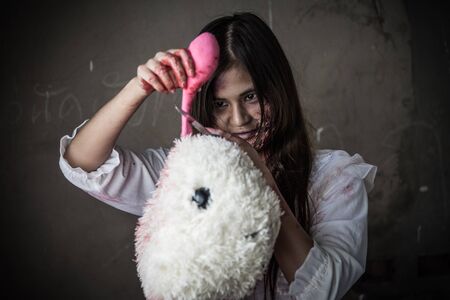 Zombie or Ghost holding knife kill baby doll ,halloween conceptの写真素材