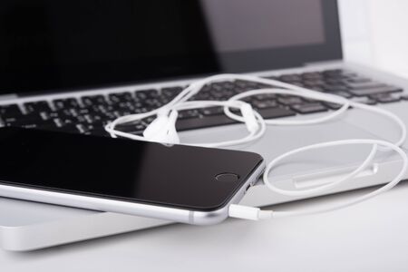 laptop,notebook and mobile phone, smartphone on office desk table.の写真素材