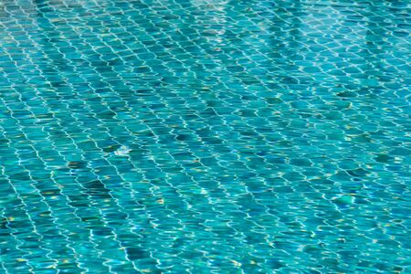 Blue swimming pool water texture reflection lightingの写真素材
