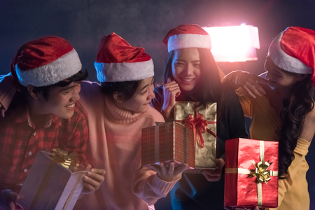 Group Asian young having fun at New Year's Party, holding Gift Box, Christmas or New Year conceptの写真素材