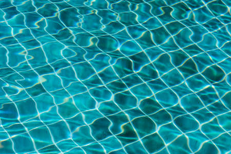 Blue swimming pool water texture reflection lightingの写真素材