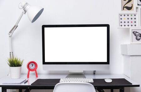 Monitor PC momputer on the working place in house office white wallの写真素材