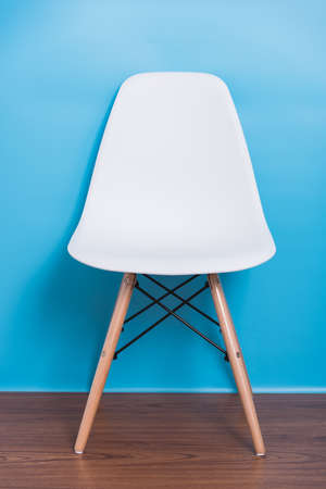 Modern white chair nobody in blue room backgroundの写真素材
