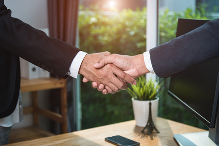 Businessman Handshake cooperate together friendship after meetingの写真素材