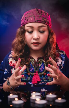 Female seer teller doing psychic reading predicting fate