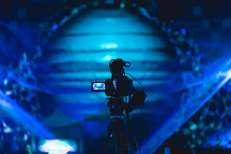 Cameraman shooting video production camera videographer in concert music festivalの写真素材