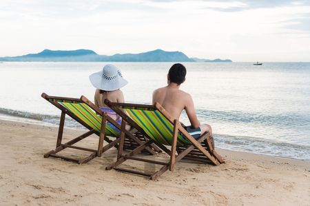 Couple luxury family travel relax on tropical beach in vacation summerの写真素材