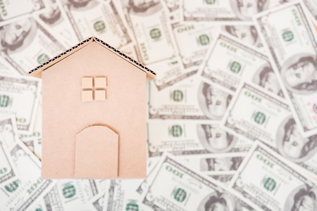 House cardboard model on dollar money, currency money conceptの写真素材