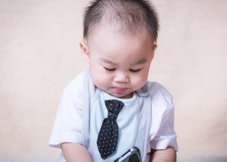 Portrait Baby boy business child with a necktie in studioの写真素材