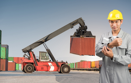 Foreman stand on front forklift loading Containers box to Logistic cargo Import Exportの写真素材