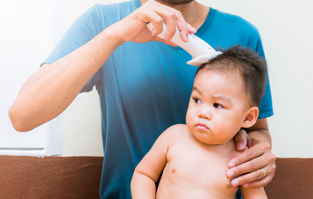 Asian child baby boy caucasian haircut hairの写真素材