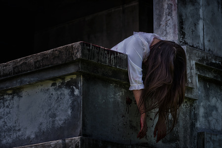 Zombie Ghost woman murder underhung head on abandoned building with bloody ,halloween conceptの写真素材
