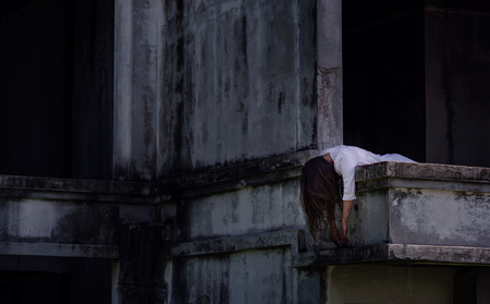 Zombie Ghost woman murder underhung head on abandoned building with bloody ,halloween conceptの写真素材
