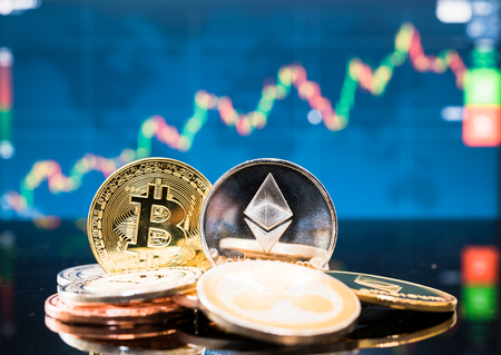 Business bitcoin and ethereum coin finance money on graph chart backgroundの写真素材