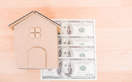 House cardboard model on dollar money, currency money conceptの写真素材