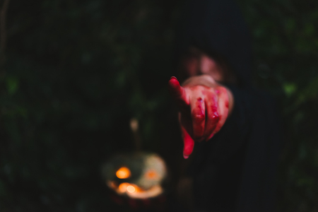 Portrait woman scary ghost in forest he has point finger out, halloween conceptの写真素材