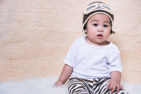 Asian Funny baby boy plane pilot aviatorの写真素材