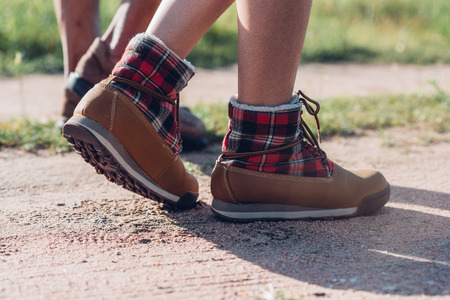Close up Legs of couple hiking walking outdoor in nature forest