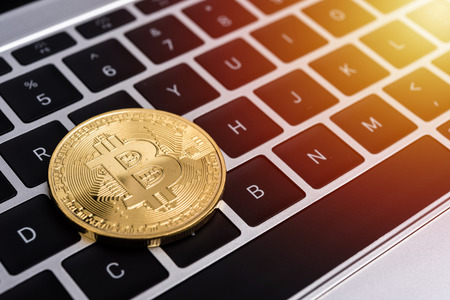 Coin, virtual golden bitcoin money on keyboard laptop computer,の写真素材