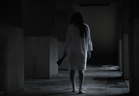 Horror woman ghost creepy holding knife for kill, halloween day conceptの写真素材