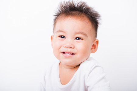 Asian portrait happy kid boys 1 year 6 months smile on white backgroundの写真素材