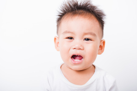 Asian portrait happy kid boys 1 year 6 months smile on white backgroundの写真素材