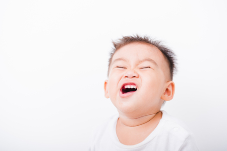 Asian portrait child boys 1 year 6 months expression funny face on white backgroundの写真素材