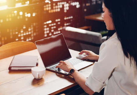 Women freelancer work independently with laptop computer in coffee shopの写真素材