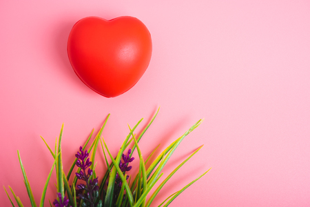 Red heart on pink background with copy space, valentine day conceptの写真素材