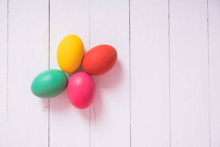 Colorful easter eggs clean on wooden background, easter day conceptの写真素材