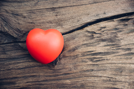 Red heart love on wooden background, valentine day conceptの写真素材