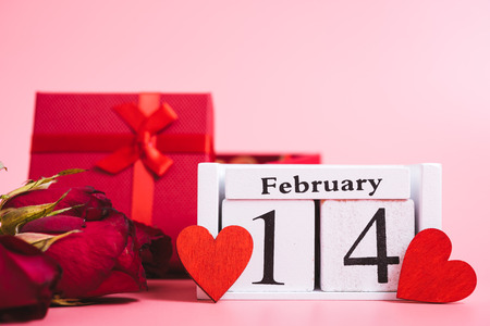 Red wood Hearts and gift box on pink background, 14 February, valentine day conceptの写真素材