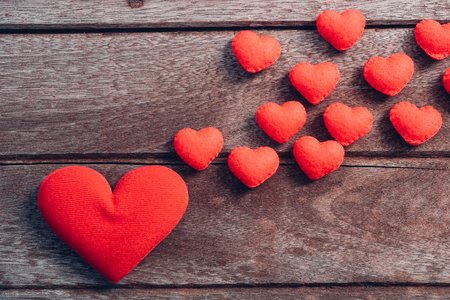 Fabric red heart on wooden background, valentine day conceptの写真素材