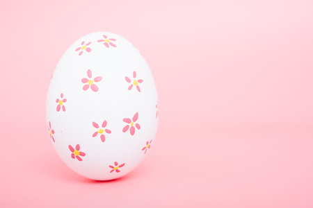 Beautiful Easter White egg color on pink background, Easter day conceptの写真素材