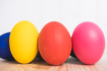 Easter eggs clean on wooden and white background, easter day conceptの写真素材