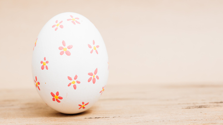 Beautiful Easter White egg on wooden background, Easter day conceptの写真素材