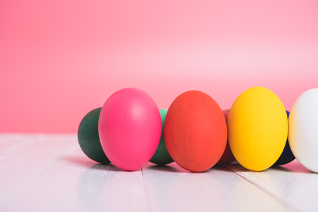 Easter eggs clean on wooden and pink background, easter day conceptの写真素材