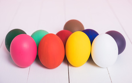 Colorful easter eggs clean on wooden background, easter day conceptの写真素材