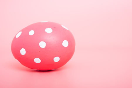 Beautiful Easter Pink egg color on pink background, Easter day conceptの写真素材