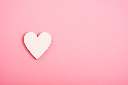 Wood hearts on pink background have copy space, valentine day conceptの写真素材