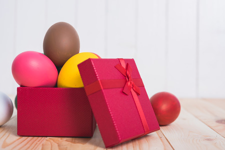 Easter eggs clean in red box gift on wooden background, easter day conceptの写真素材