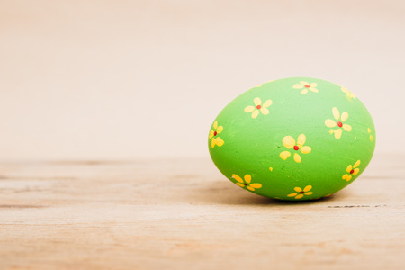 Beautiful Easter Green egg on wooden background, Easter day conceptの写真素材