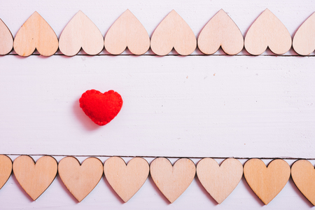 Wood hearts on white wooden background have frame copy space, valentine day conceptの写真素材